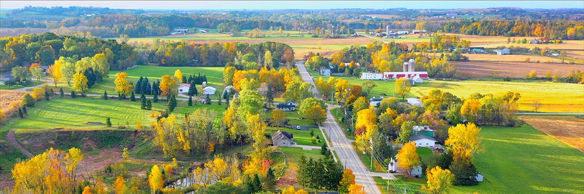 Aerial shot of rural land bisected by a main road